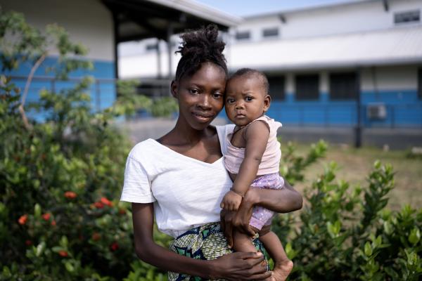 Fatimata Foday holds her six-month old baby girl Bintu