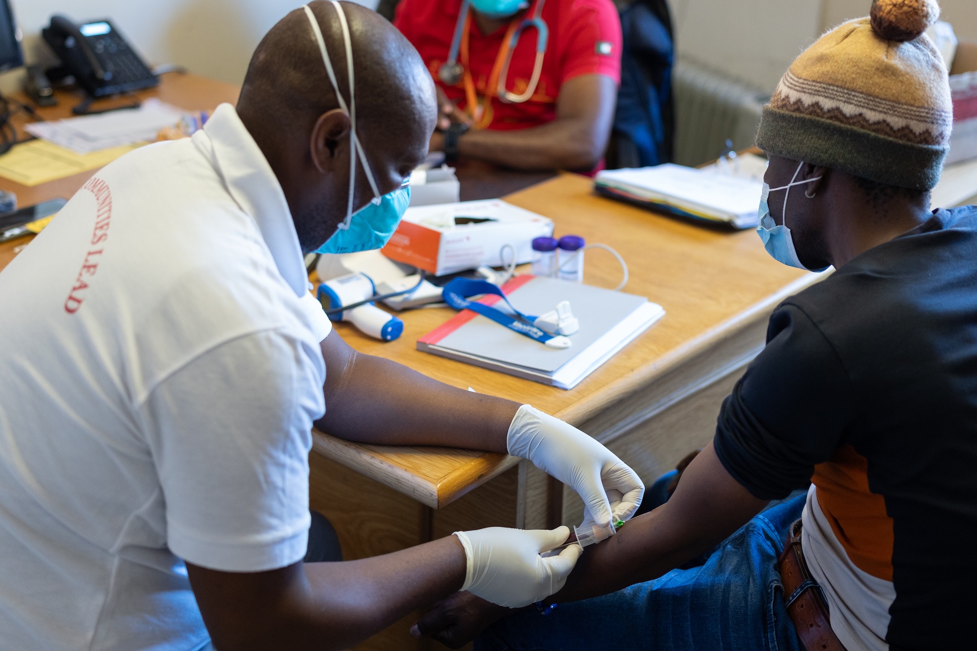 PIH nurse Seabata Ntsibane administers treatment to MDR-TB patient Khamokha Khamokha.