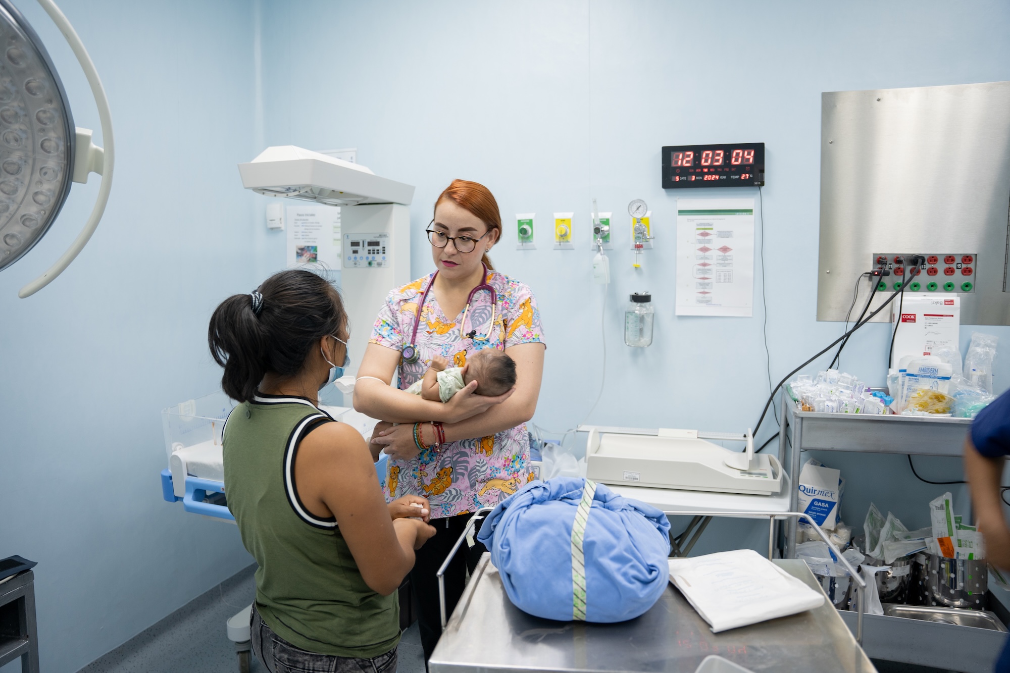 CES pediatrician during a brief consultation with a patient and his mother.